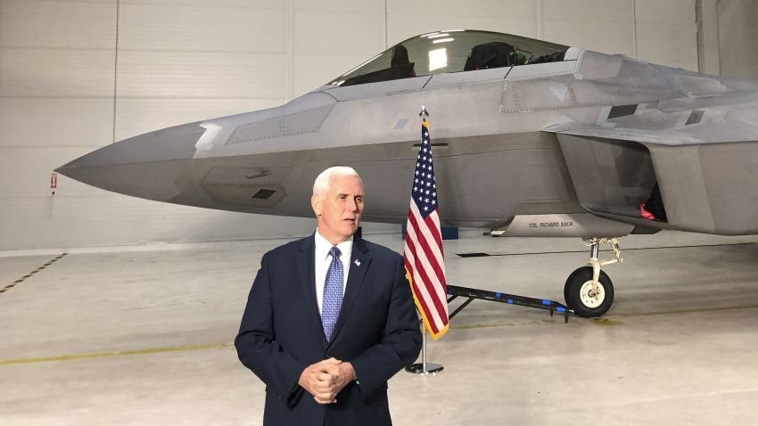 Vice President Mike Pence addresses the media standing in front of an F-22 at Joint Base Elmendorf-Richardson, Alaska, Monday, Feb. 5, 2018. (AP Photo/Zeke Miller)