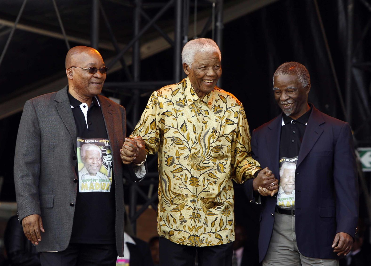 From left, Zuma, Mandela and Mbeki arrive on stage for Mandela's 90th birthday celebration in August 2008.