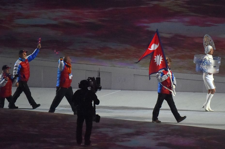 The flag of Nepal, seen here at the opening ceremony of the 2014 Winter Games in Sochi, is the only non-quadrilateral national flag in the world. It is composed of two combined triangles, and it's the only national flag that is flown at Olympic parades of nations in a format other than a rectangle.