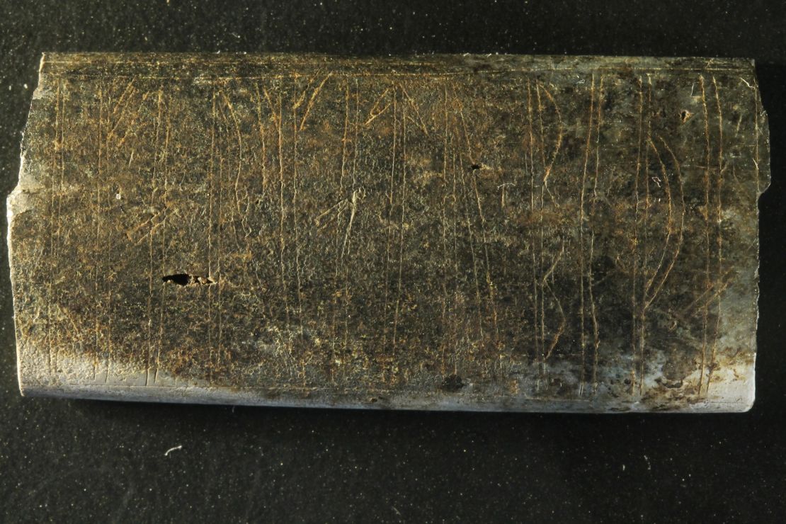A fragment of a plate with a yet undeciphered inscription