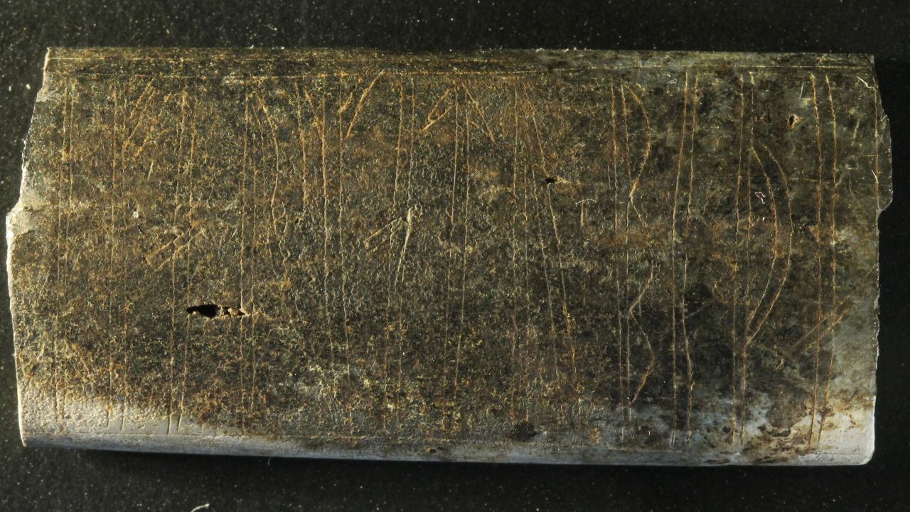 A fragment of a plate with a yet undeciphered inscription