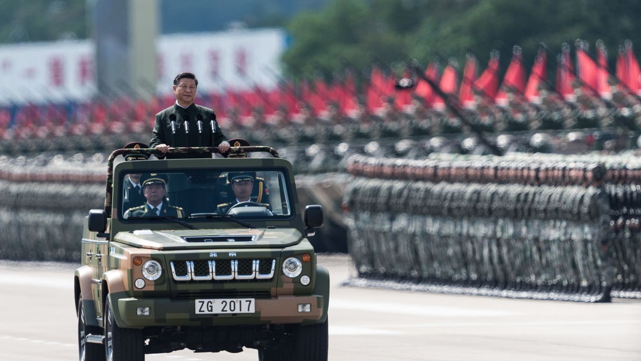 China's President Xi Jinping inspects People's Liberation Army soldiers at a barracks in Hong Kong on June 30, 2017.