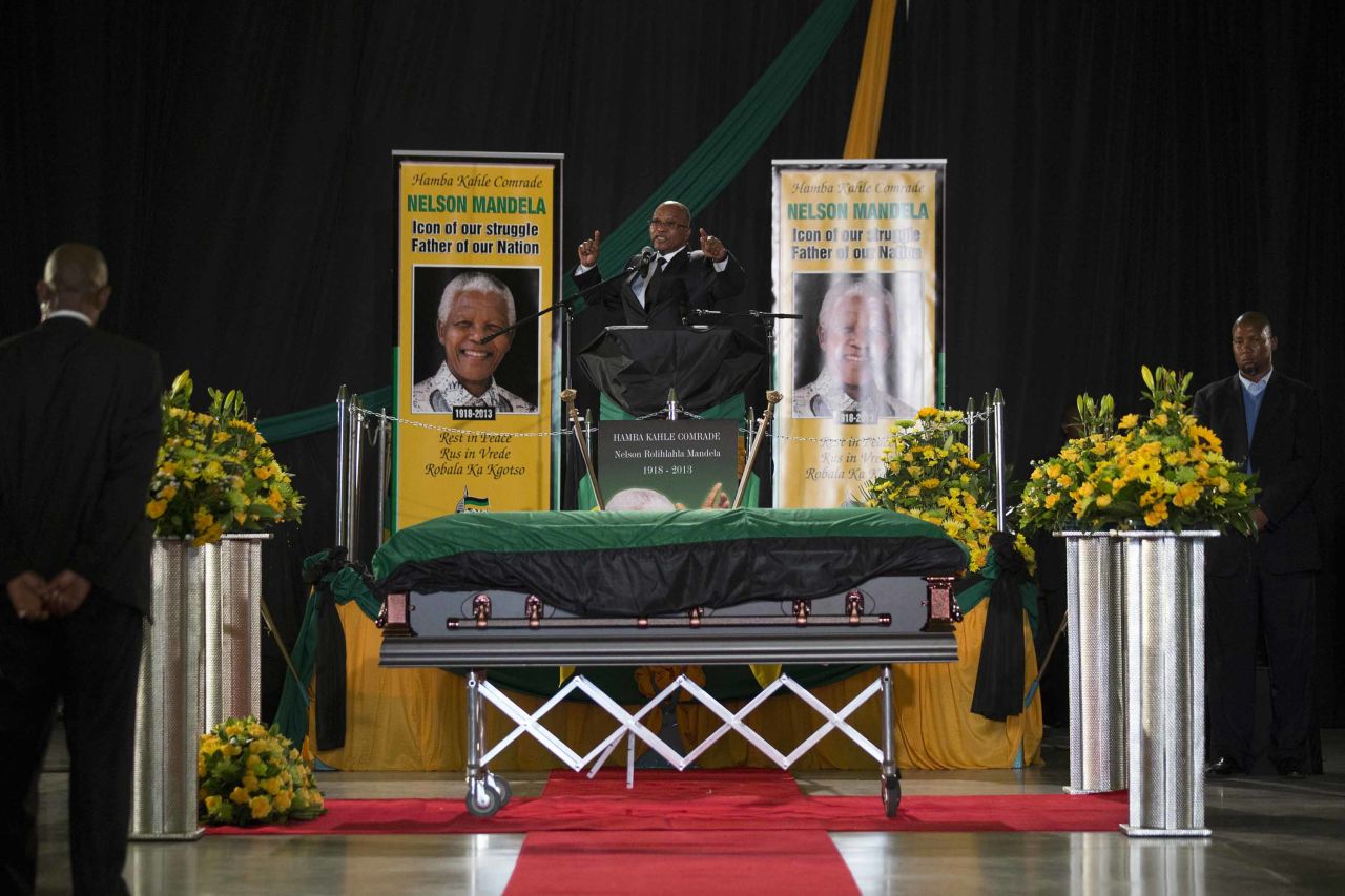 Zuma sings during a send-off ceremony for former President Nelson Mandela, who died in December 2013 at the age of 95.