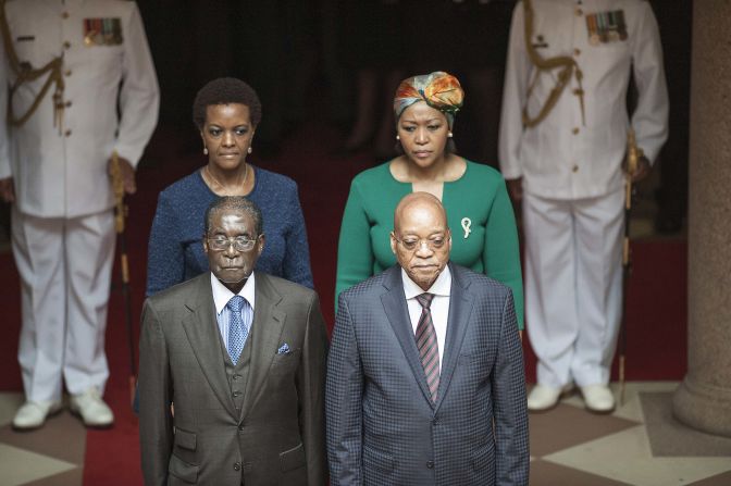Zuma and his wife Thobeka Mabhija, right, pose with then Zimbabwean President <a href="index.php?page=&url=http%3A%2F%2Fedition.cnn.com%2F2013%2F07%2F31%2Fafrica%2Fgallery%2Frobert-mugabe%2Findex.html" target="_blank">Robert Mugabe</a> and his wife, Grace, as they meet in Pretoria in April 2015.
