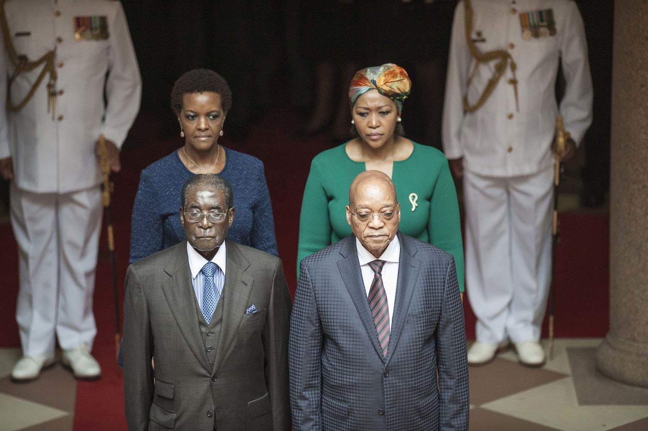 Zuma and his wife Thobeka Mabhija, right, pose with then Zimbabwean President <a href="http://edition.cnn.com/2013/07/31/africa/gallery/robert-mugabe/index.html" target="_blank">Robert Mugabe</a> and his wife, Grace, as they meet in Pretoria in April 2015.
