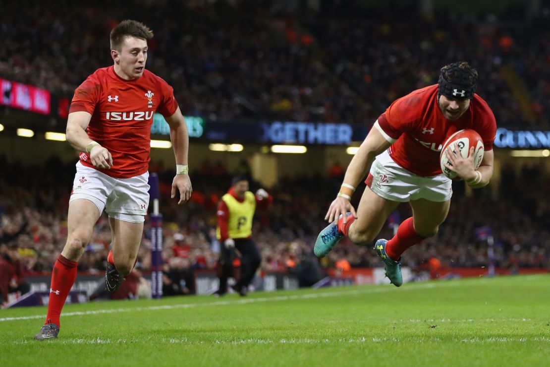 Leigh Halfpenny (right) dives over for his second try against Scotland.