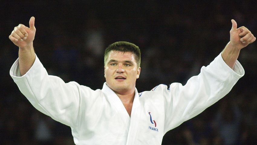 SYDNEY, AUSTRALIA:  David Douillet of France celebrates his gold medal victory in the Olympic men's heavyweight over 100kg final against Shinichi Shinohara of Japan, 22 September 2000 at the Sydney 2000 Olympic Games. Douillet, who won the bronze medal in the 1992 Barcelona Games and the gold at the 1996 Atlanta Games was also the World heavyweight champion in 1993, '95 and '96. AFP PHOTO/KIM Jae-Hwan (Photo credit should read KIM JAE-HWAN/AFP/Getty Images)