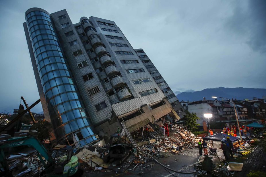 Rescue services search for people at a damaged building in Hualien, Taiwan, on Wednesday, February 7. A 6.4 magnitude earthquake was recorded about 21 kilometers (13 miles) north of Hualien late Tuesday. Several people were killed and many were injured.