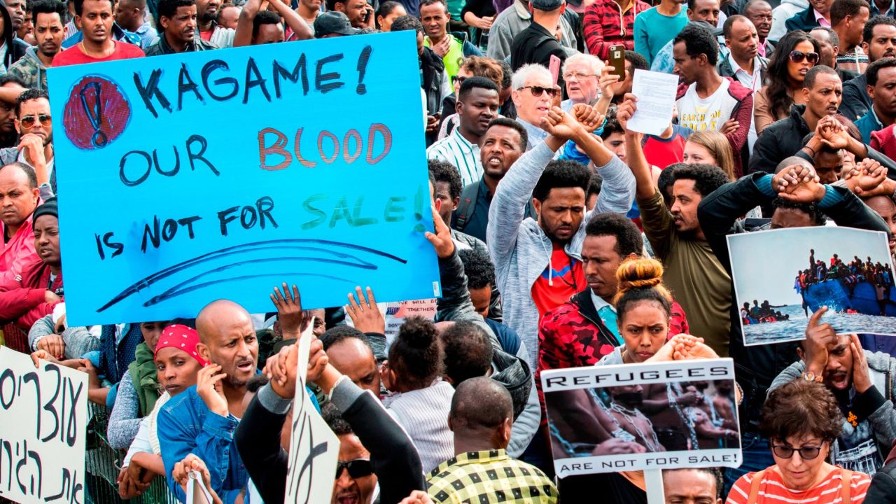 African migrants demonstrate outside the Embassy of Rwanda in the Israeli city of Herzliya on February 7.