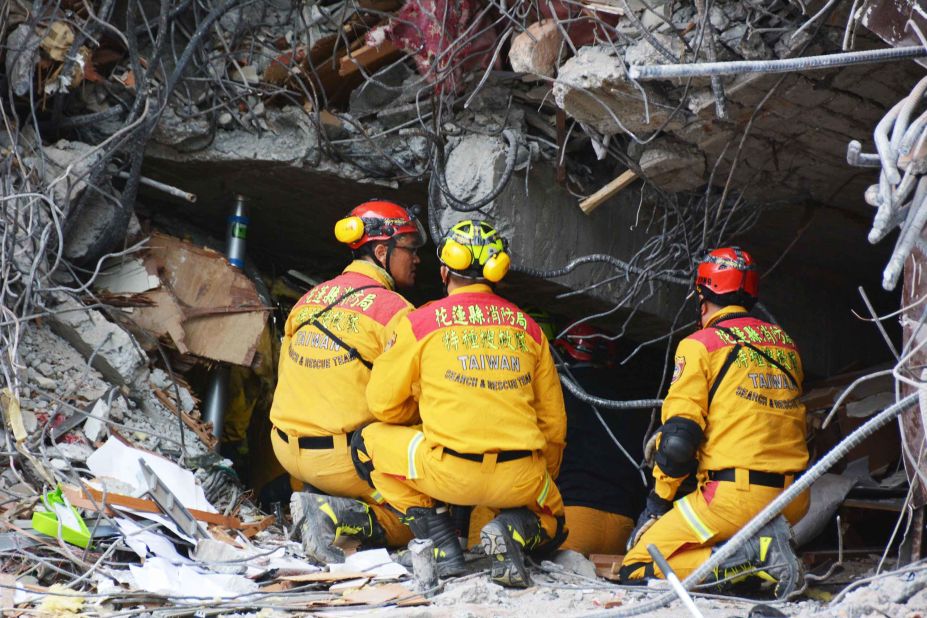 A crew searches for survivors believed to be trapped inside the collapsed Marshal Hotel in Hualien.