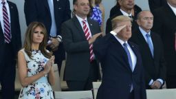 US President Donald Trump (2nd L) salutes as French President Emmanuel Macron (2nd R) his wife Brigitte Macron (R) and US First Lady Melania Trump (L) watch the annual Bastille Day military parade on the Champs-Elysees avenue in Paris on July 14, 2017.
The parade on Paris's Champs-Elysees will commemorate the centenary of the US entering WWI and will feature horses, helicopters, planes and troops. / AFP PHOTO / CHRISTOPHE ARCHAMBAULT        (Photo credit should read CHRISTOPHE ARCHAMBAULT/AFP/Getty Images)