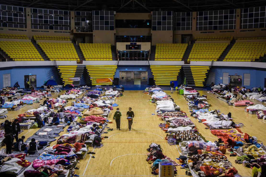 Residents take shelter in a local stadium after an earthquake and aftershocks on February 7.