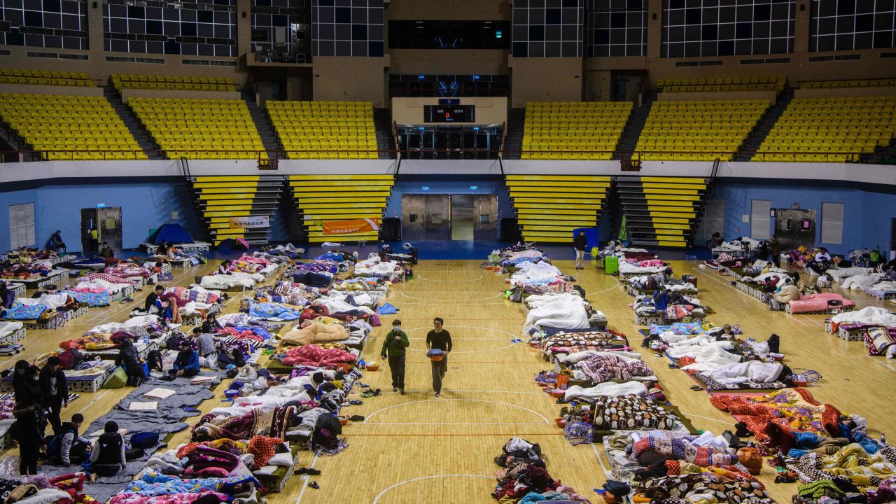 Residents take shelter in a local stadium after an earthquake and aftershocks on February 7.