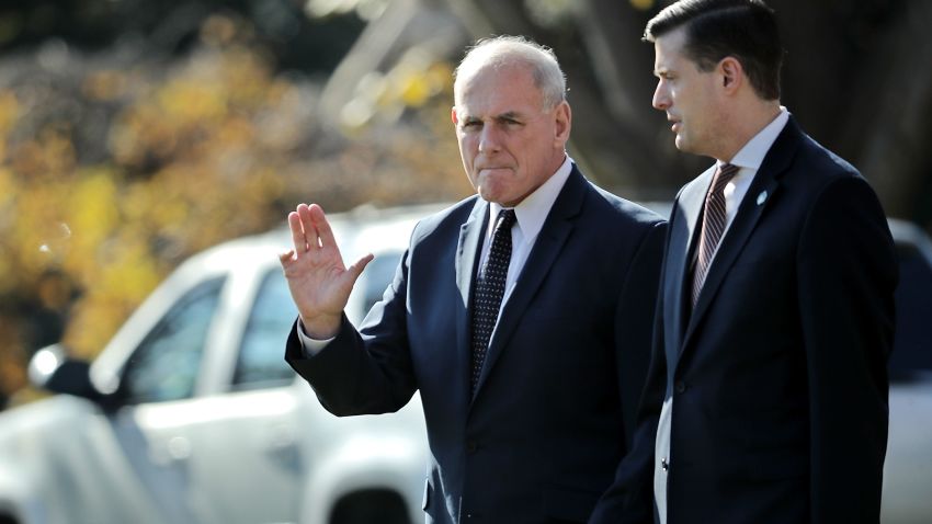 WASHINGTON, DC - NOVEMBER 29:  White House Chief of Staff John Kelly (L) waves to journalists as he and Staff Secretary Rob Porter leave the White House with U.S. President Donald Trump November 29, 2017 in Washington, DC.