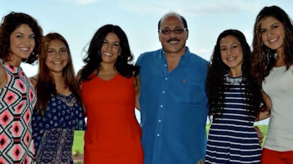 A family photo of Amer Adi with his wife and daughters. 