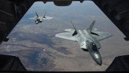 A handout photo made available by the US Department of Defense shows two US Air Force F-22 Raptors flying above Syria in support of Operation Inherent Resolve on Friday.