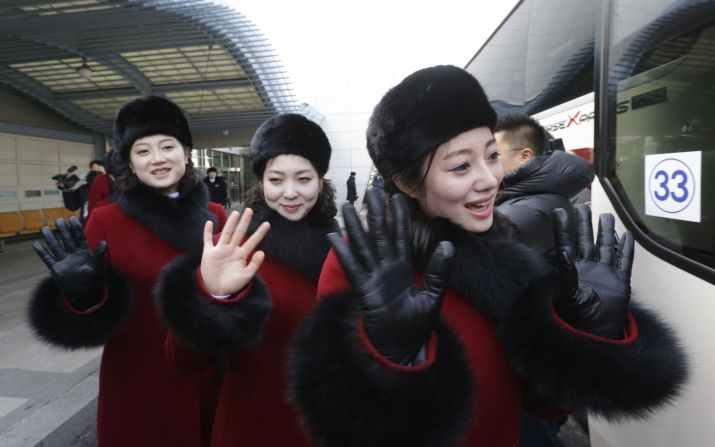 North Korean cheering squads wave upon arriving at the Korean-transit office near the Demilitarized Zone on February 7, 2018 in Paju, South Korea. 