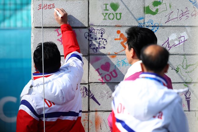 North Korea's Vice Sports Minister Won Gil-woo signs the Welcome Wall ahead of the PyeongChang 2018 Winter Olympic Games.