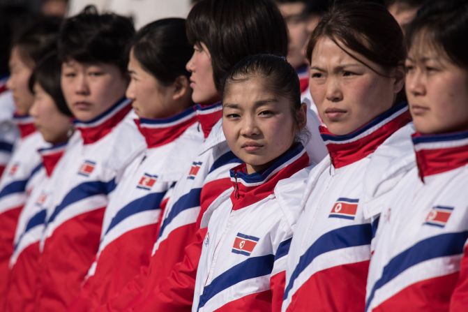 North Korea's figure skater Ryom Tae Ok (C) stands with her teammates at the athletes village of the 2018 Pyeongchang Winter Olympic games.
