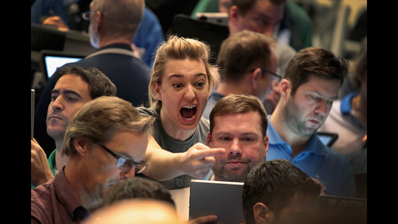 Traders signal offers in the S&P options pit in Chicago on Tuesday, February 6. Stocks went into free-fall the day before, and the Dow plunged almost 1,600 points -- easily <a href="http://money.cnn.com/2018/02/05/investing/stock-market-today-dow-jones/index.html" target="_blank">the biggest point decline in history during a trading day</a>.