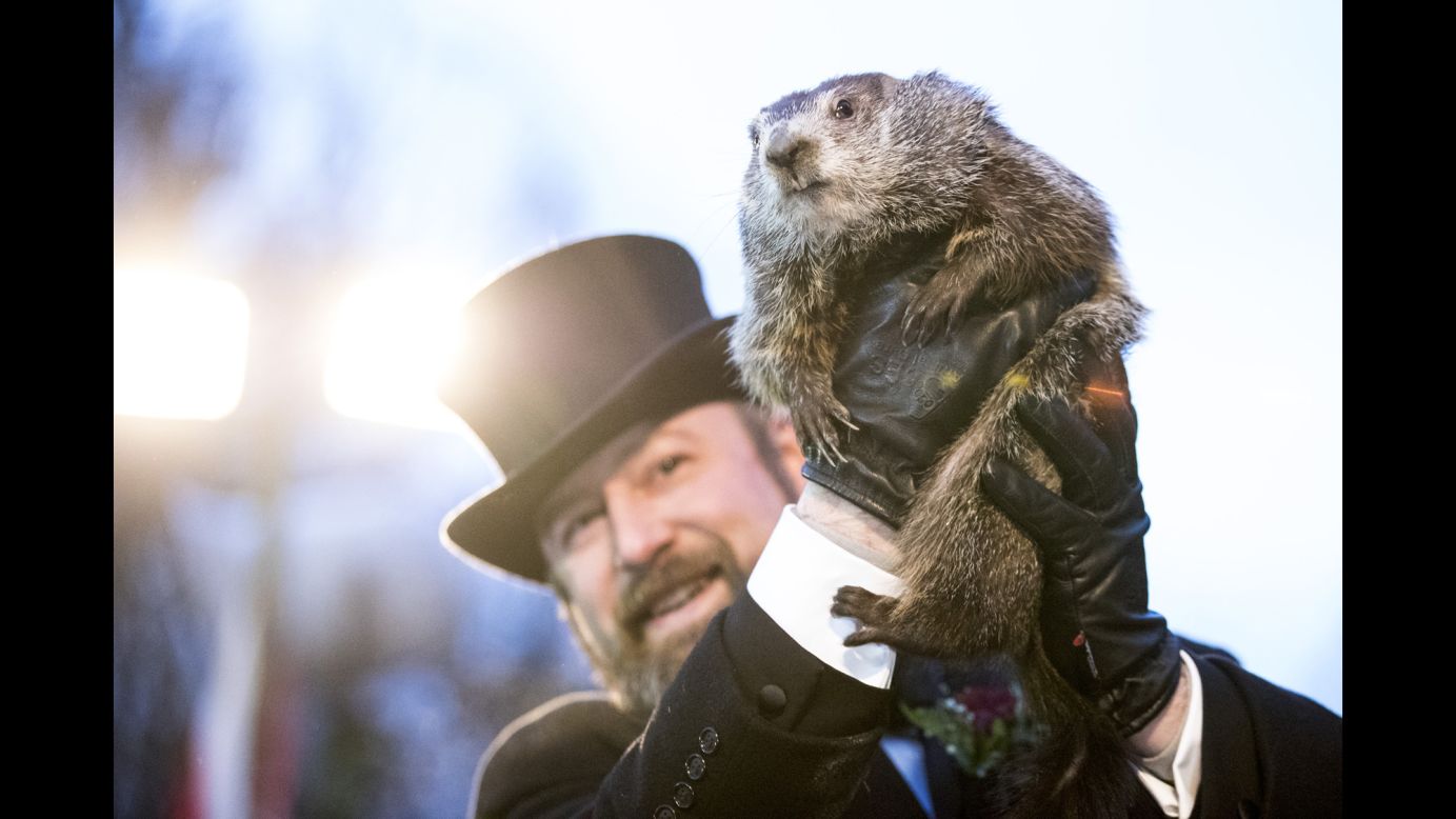 Punxsutawney Phil is held up by his handler during the Groundhog Day ceremony in Punxsutawney, Pennsylvania, on Friday, February 2. <a href="https://www.cnn.com/2018/02/02/us/groundhog-day-2018-shadow-trnd/index.html" target="_blank">Punxsutawney Phil saw his shadow</a>, an omen indicating six more weeks of winter.