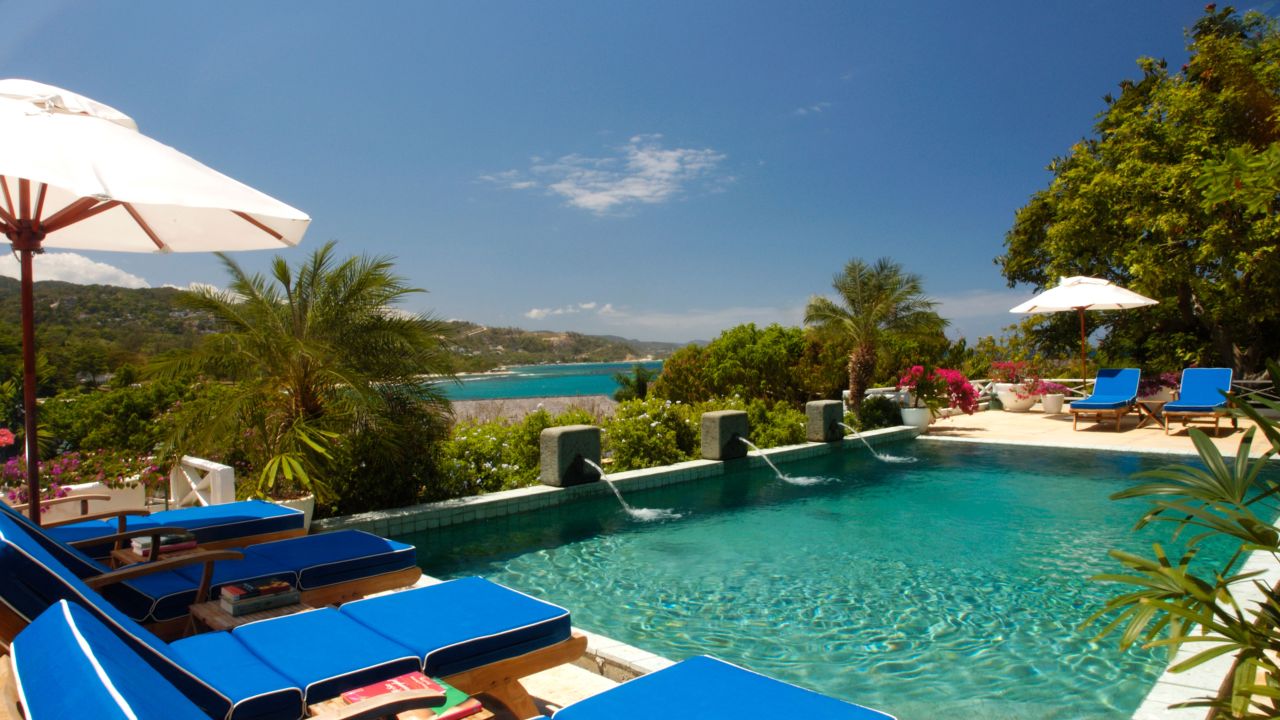 Enjoy a dip in the pool at Round Hill Hotel in Jamaica.