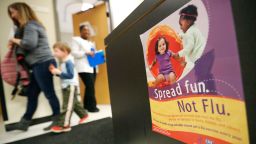 An information poster for the flu hangs in a Dekalb County health center in Decatur, Ga., Monday, Feb. 5, 2018. The U.S. government's latest flu report released on Friday, Feb. 2, 2018, showed flu season continued to intensify the previous week, with high volumes of flu-related patient traffic in 42 states, up from 39 the week before. (AP Photo/David Goldman)