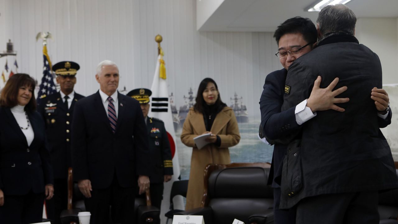 Fred Warmbier(R), the father of Otto warmbier who was imprisoned in North Korea for 17 months gives hug to Ji Seong-ho (second left), North Korean defector while U.S. Vice President Mike Pence looks on.
