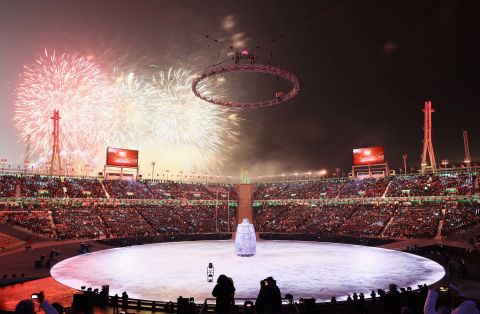 Fireworks explode as the opening ceremony begins.