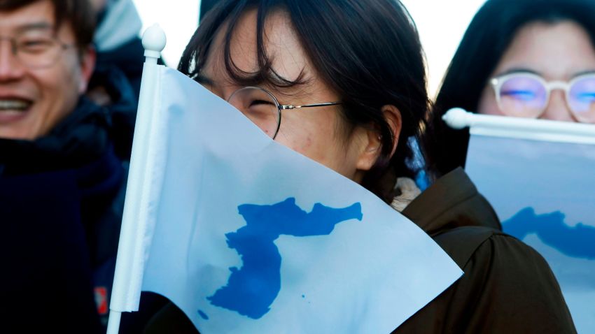 INCHEON, SOUTH KOREA - FEBRUARY 04:  South Korean peace activists carry the Flag of Korean Peninsula before the Women's Ice Hockey friendly match at Seonhak International Ice Rink on February 4, 2018 in Incheon, South Korea. The friendly match is held ahead of the Olympic Games where South and North Korea competes for the first time as a unified team in a sport at the Olympic Games.  (Photo by Woohae Cho/Getty Images)