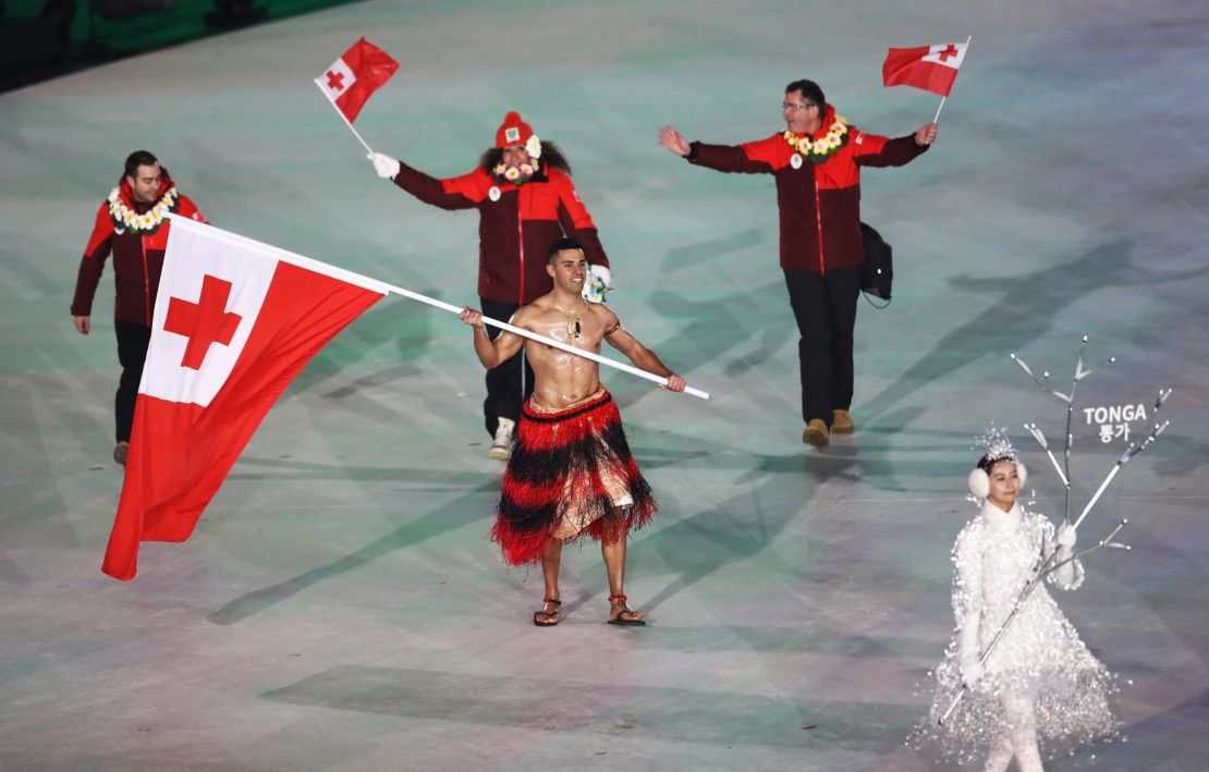 Flag bearer Pita Taufatofua of Tonga leads the team during the opening ceremony.