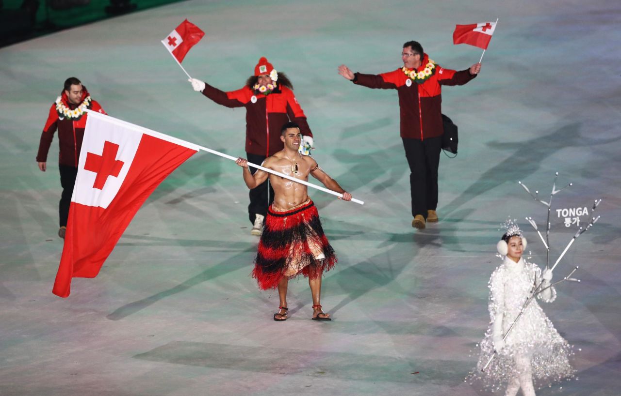 Tongan flag bearer Pita Taufatofua goes shirtless, as he did for the opening ceremony of the 2016 Summer Olympics.