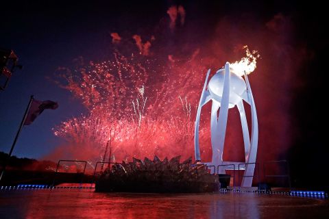 Fireworks erupt as the Olympic cauldron is lit in Pyeongchang, South Korea, on Friday, February 9.