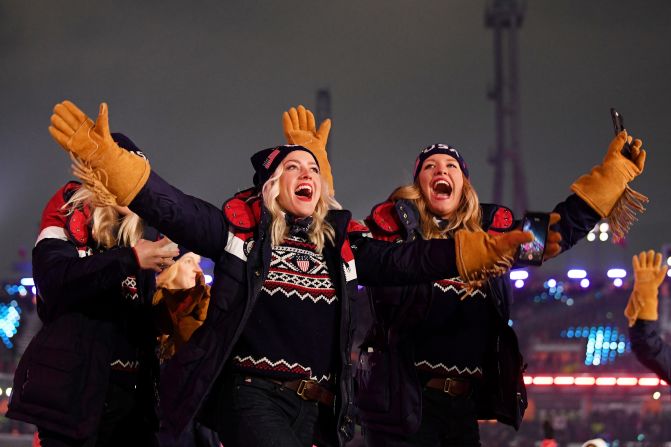 American athletes wave during the march of nations.
