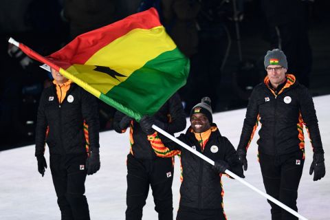 The country's flagbearer Akwasi Frimpong leads the delegation as they parade during the opening ceremony. Frimpong is a Dutch-Ghanaian sprinter. He is also the first Ghanaian-born athlete to represent the country in Skeleton. 