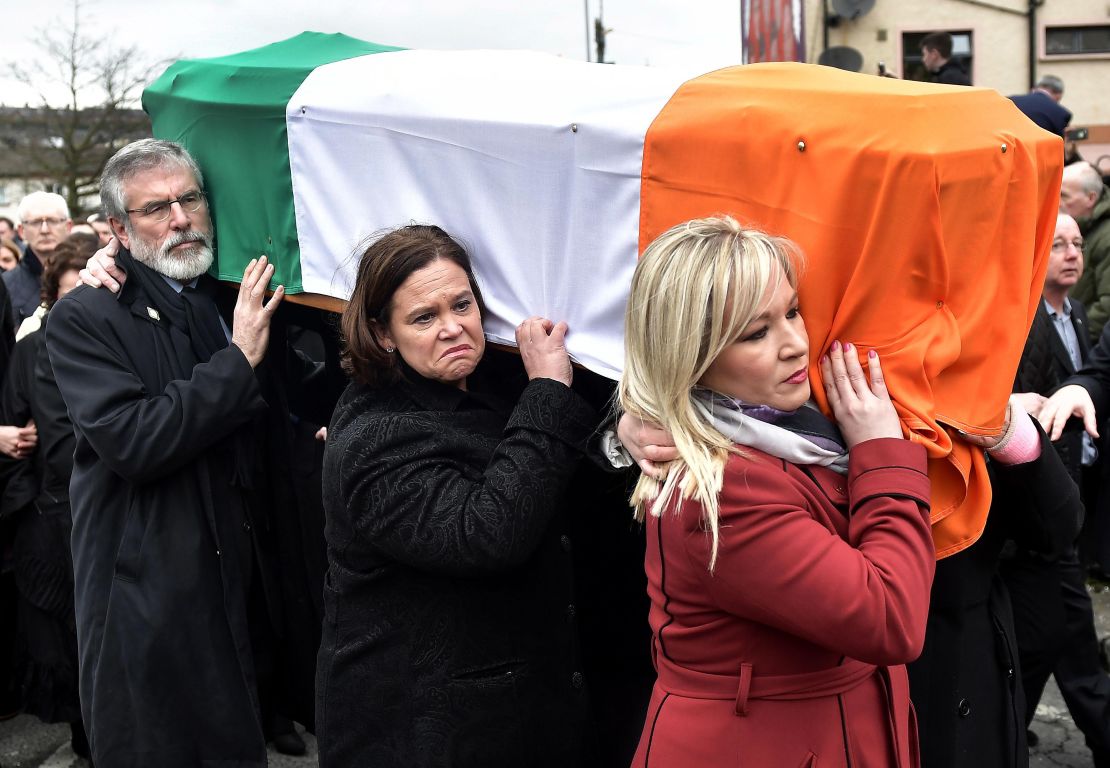 Gerry Adams (L), Mary Lou McDonald (C) and Sinn Fein northern leader Michelle O'Neill  carry the coffin of the late Martin McGuinness in March 2017. 
 