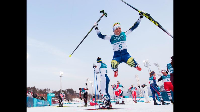 Sweden's Charlotte Kalla celebrates after winning the first gold medal of the Games.