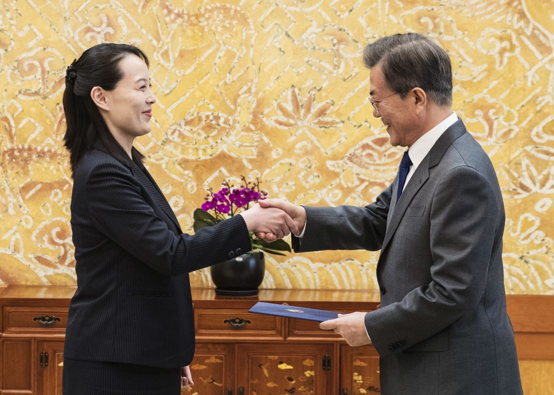 South Korean President Moon Jae-in, right, shakes hands with Kim Yo Jong.