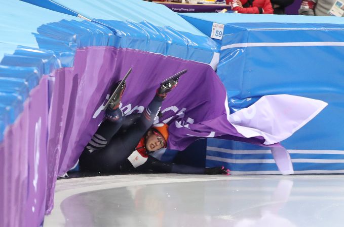 Suzanne Schulting of the Netherlands crashes in her 500-meter heat in short track speedskating.