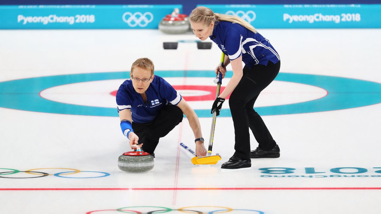 Tomi Rantamaeki and Oona Kauste of Finland compete in the mixed curling round robin against China.