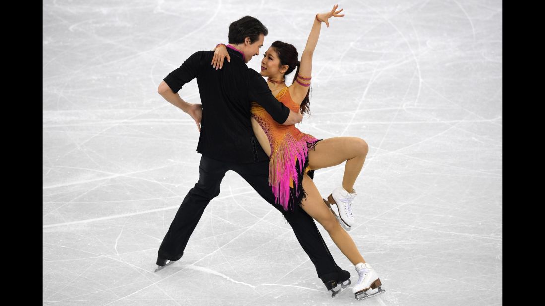 Japan's Kana Muramoto and Chris Reed compete in the team figure skating short dance event.