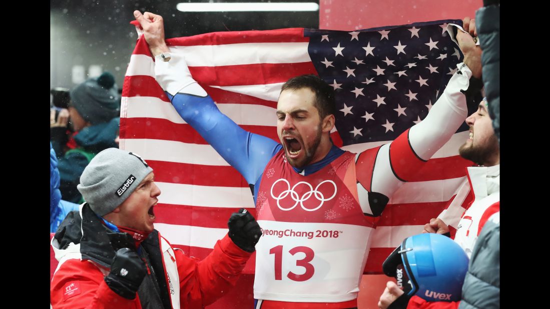 Silver medalist Chris Mazdzer celebrates after capturing the first-ever men's singles luge medal for the United States.