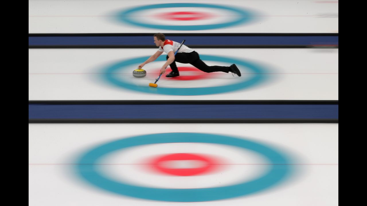 Norway's Magnus Nedregotten and Kristin Skaslien, out of frame, compete in a curling mixed doubles tie-breaker against Dexin Ba and Rui Wang of China.