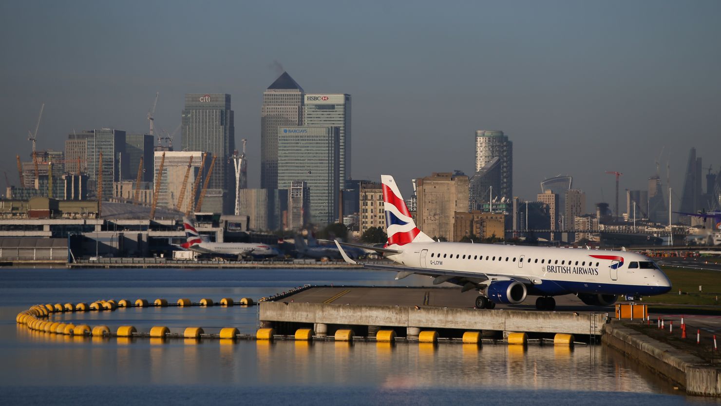 A plane waits on the runway at London City Airport.