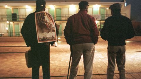 In 1998, three former Memphis sanitation workers -- from left to right, Eugene Brown, James Jones and Lafayette Shields --
stand silhouetted in the lights of the National Civil Rights Museum after a memorial service for the late Dr. Martin Luther King in Memphis, TN. Brown and Jones were part of the original sanitation workers strike, 30 years ago, that brought Dr. King to Memphis before he was killed by a sniper. Hundreds turned out for a 30th anniversary vigil at the former Lorraine Motel, now the National Civil Rights Museum, where King was slain as he stepped from his room in 1968.
