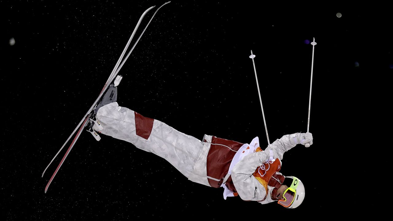 Canadian skier Mikael Kingsbury catches some air on his way to winning gold in the moguls.