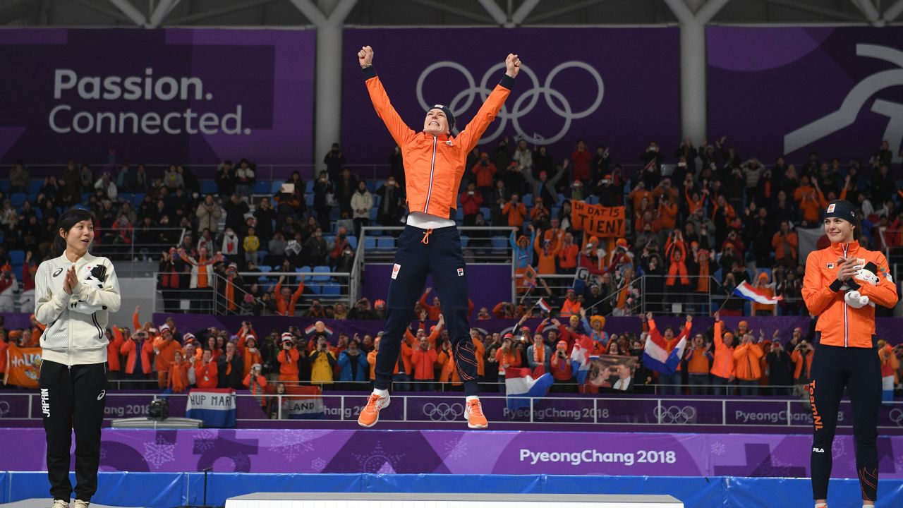 Dutch speedskater Ireen Wust celebrates on the podium after winning the 1,500 meters. Wust now has 10 medals in her career, making her the most decorated skater in Olympic history.