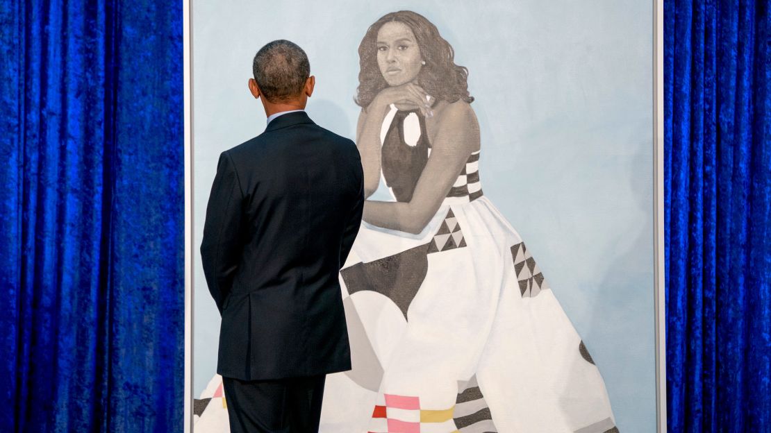 Former President Barack Obama, looks at former first lady Michelle Obama's official portrait at the Smithsonian's National Portrait Gallery.