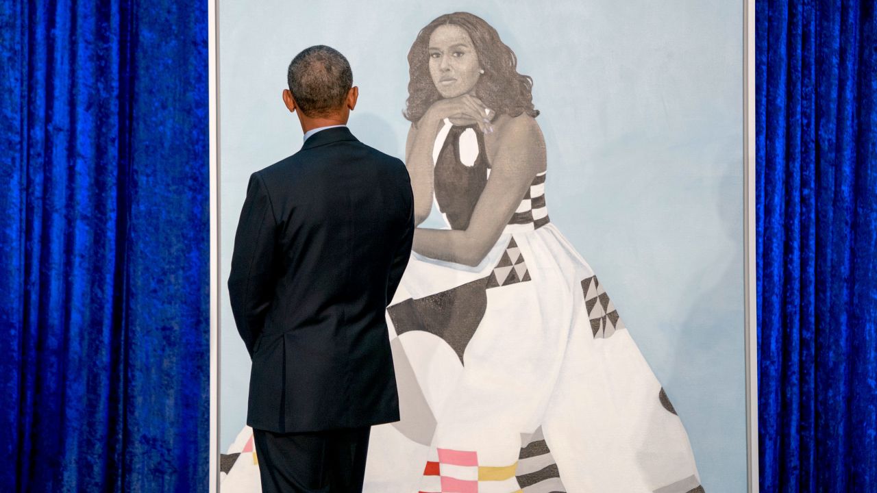 Former President Barack Obama, looks at former first lady Michelle Obama's official portrait at the Smithsonian's National Portrait Gallery, Monday, Feb. 12, 2018, in Washington.