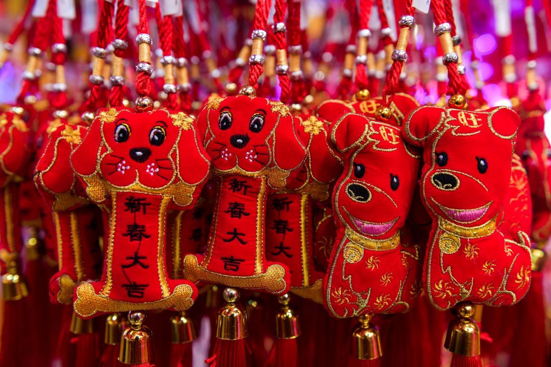Decorative dog figurines are seen for sale ahead of the Lunar New Year celebrations in Kuala Lumpur's Chinatown on January 26, 2018.